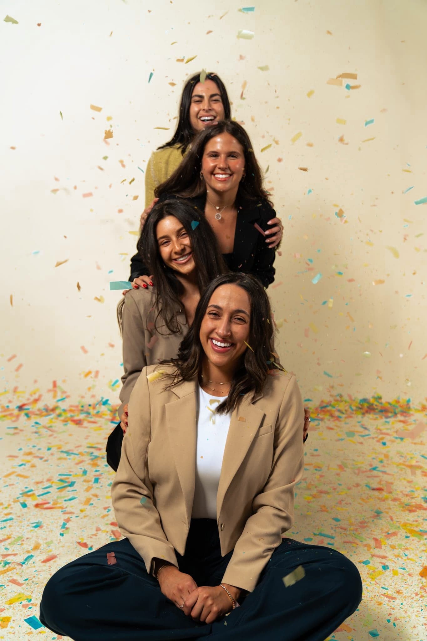 The Just Start LA team stacked together under falling confetti