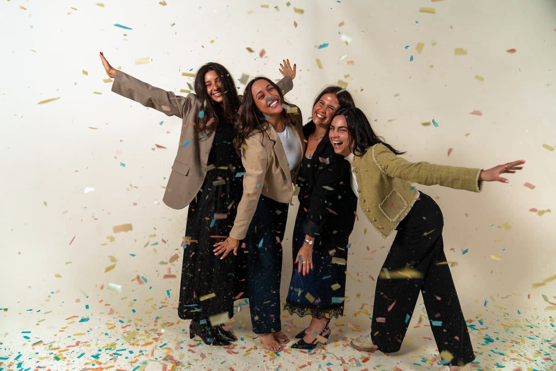 The Just Start LA team celebrating together under falling confetti