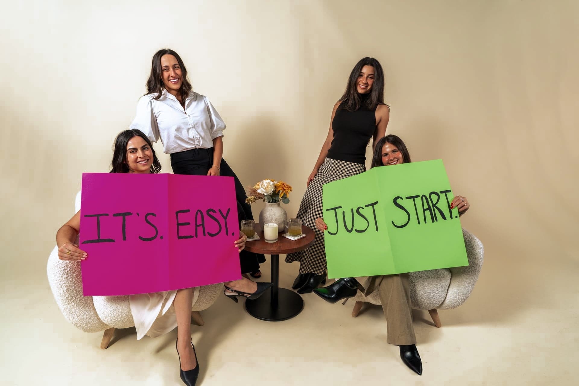 The Just Start LA team holding signs that read It's Easy. Just Start.
